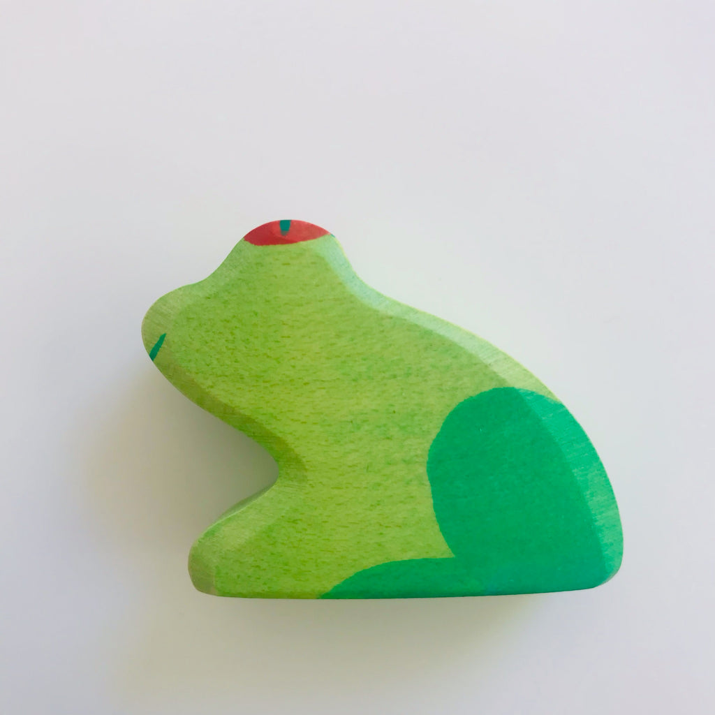 hand made wood toy frog. dual green detail with red eyes