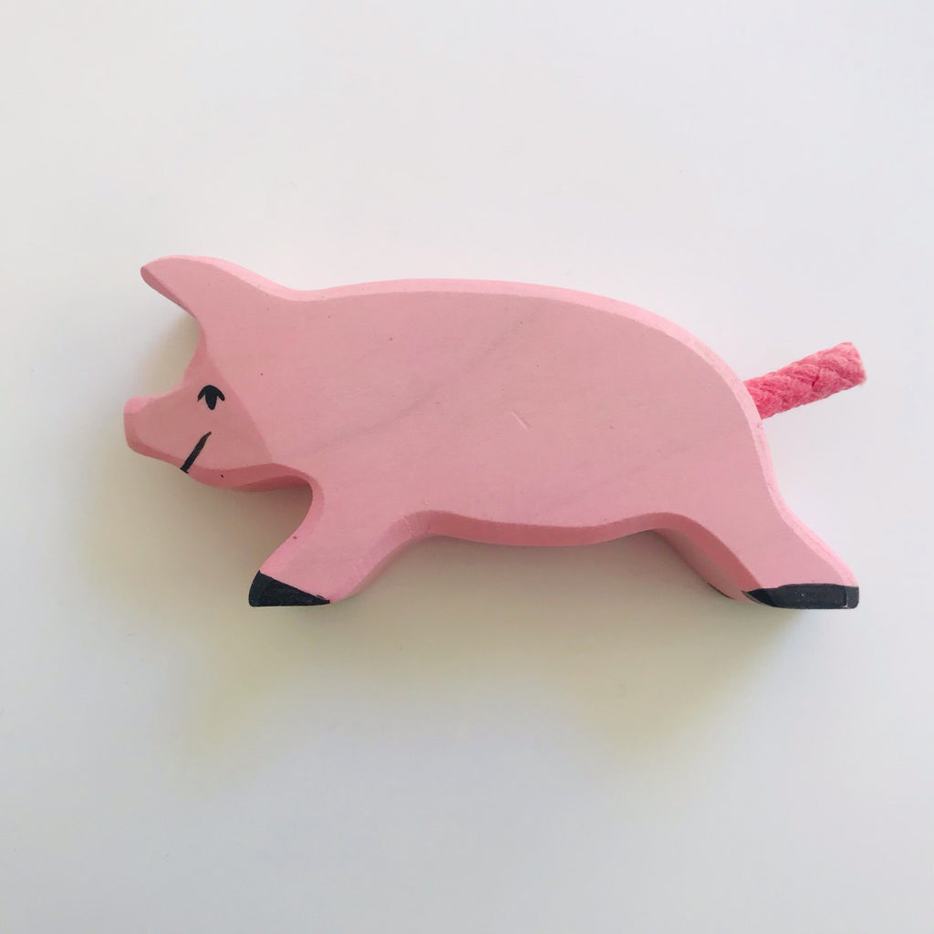 hand made piglet, painted pink by hand by holztiger